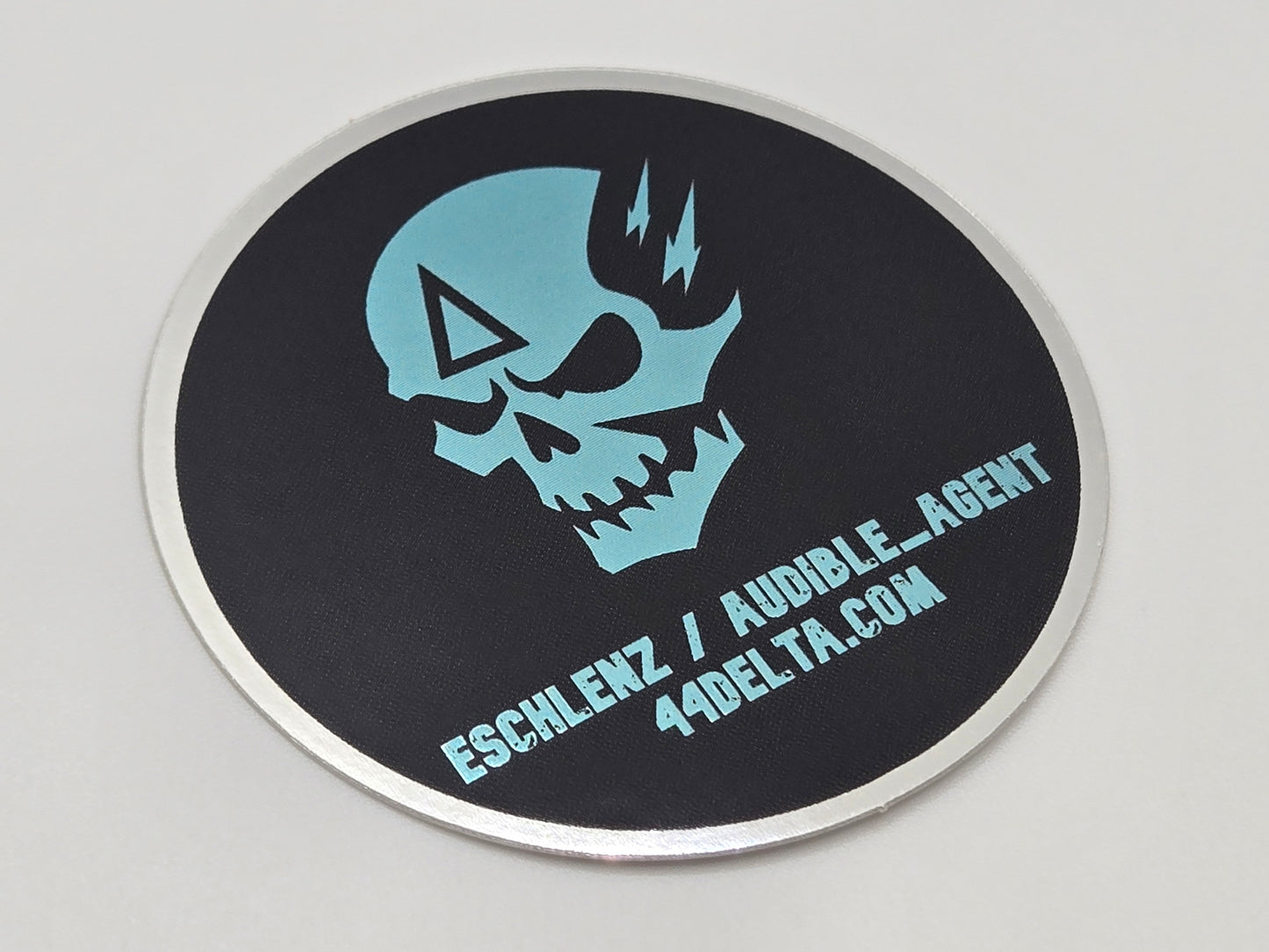 eschlenz / auDiBLe_aGeNT Sticker