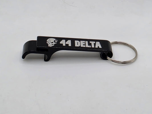 Black aluminum keychain bottle opener engraved with the 44 Delta skull and logo